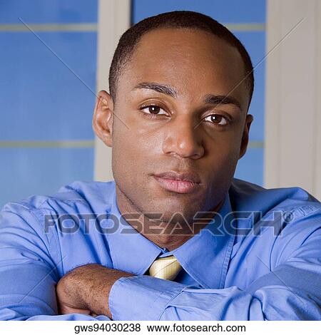 Portrait of a businessman with his arms crossed View Large Photo Image Stock Photo - Portrait of a businessman with his arms crossed. Fotosearch