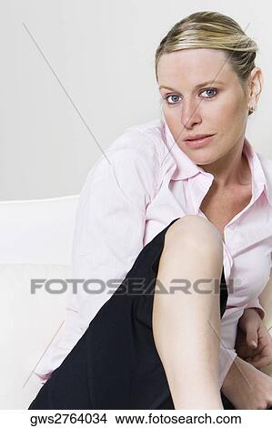 Portrait of a businesswoman sitting on the bed View Large Photo Image Picture - Portrait of a businesswoman sitting on the bed. Fotosearch