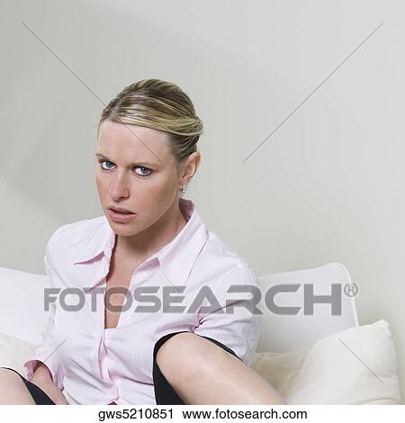 Portrait of a businesswoman sitting on the bed View Large Photo Image Stock Image - Portrait of a businesswoman sitting on the bed. Fotosearch
