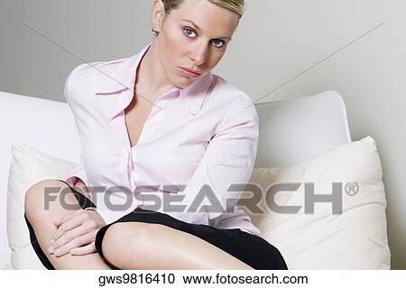 Portrait of a businesswoman sitting on the bed View Large Photo Image Stock Image - Portrait of a businesswoman sitting on the bed. Fotosearch