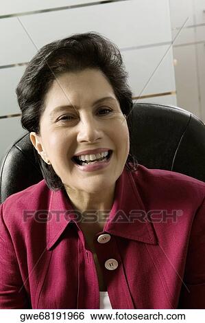 Portrait of a businesswoman smiling View Large Photo Image Stock Photograph - Portrait of a businesswoman smiling. Fotosearch