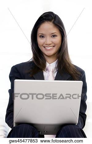 Portrait of a businesswoman using a laptop View Large Photo Image Stock Image - Portrait of a businesswoman using a laptop. Fotosearch