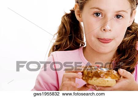 Portrait of a girl eating dessert View Large Photo Image Stock Image - Portrait of a girl eating dessert. Fotosearch