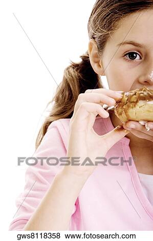 Portrait of a girl eating dessert View Large Photo Image Stock Photo - Portrait of a girl eating dessert. Fotosearch