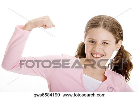 Portrait of a girl flexing her biceps View Large Photo Image Stock Image - Portrait of a girl flexing her biceps. Fotosearch