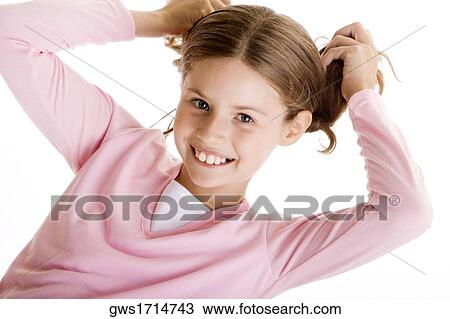 Portrait of a girl holding her pigtails View Large Photo Image Stock Image - Portrait of a girl holding her pigtails. Fotosearch