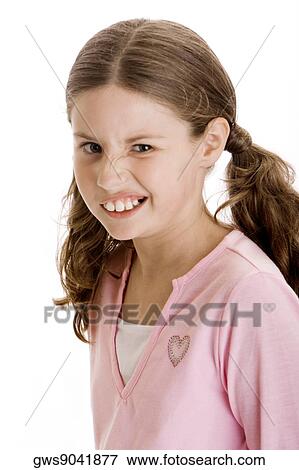 Portrait of a girl looking displeased View Large Photo Image Stock Photo - Portrait of a girl looking displeased. Fotosearch