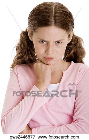 Stock Photo - Portrait of a girl with her hand on her chin. Fotosearch