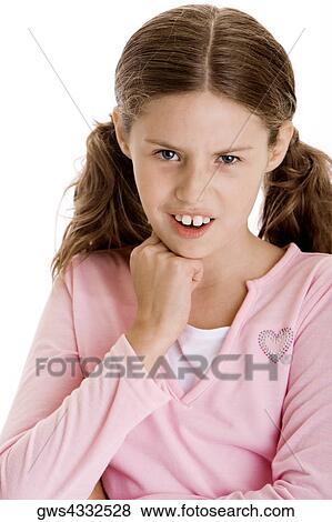 Portrait of a girl with her hand on her chin View Large Photo Image Stock Photo - Portrait of a girl with her hand on her chin. Fotosearch