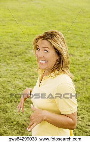 Portrait of a mature woman smiling View Large Photo Image Stock Photo - Portrait of a mature woman smiling. Fotosearch