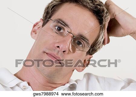 Portrait of a mid adult man looking serious View Large Photo Image Picture - Portrait of a mid adult man looking serious. Fotosearch
