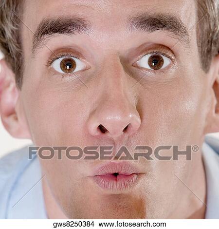 Portrait of a mid adult man looking surprised View Large Photo Image Picture - Portrait of a mid adult man looking surprised. Fotosearch