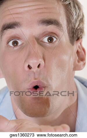 Portrait of a mid adult man looking surprised View Large Photo Image Stock Image - Portrait of a mid adult man looking surprised. Fotosearch