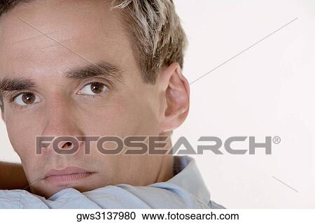 Portrait of a mid adult man looking serious View Large Photo Image Stock Image - Portrait of a mid adult man looking serious. Fotosearch