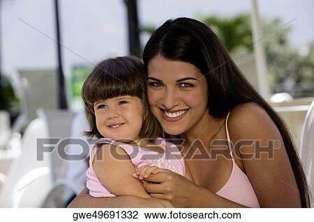 Portrait of a mother with her daughter smiling View Large Photo Image Stock Image - Portrait of a mother with her daughter smiling. Fotosearch