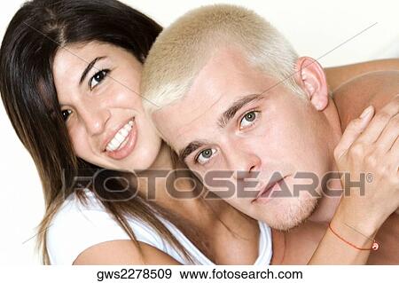 Portrait of a young couple embracing View Large Photo Image Stock Photo - Portrait of a young couple embracing. Fotosearch