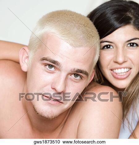 Portrait of a young couple smiling View Large Photo Image Stock Image - Portrait of a young couple smiling. Fotosearch