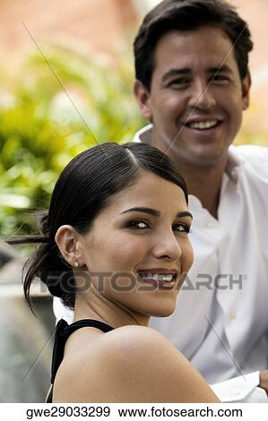 Portrait of a young couple smiling View Large Photo Image Stock Photo - Portrait of a young couple smiling. Fotosearch