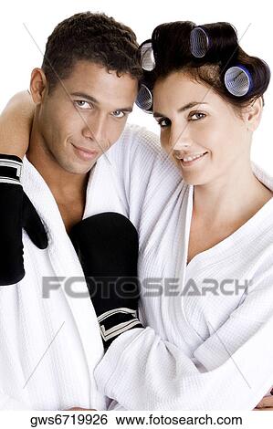 Portrait of a young couple with their arms around each other View Large Photo Image Stock Photograph - Portrait of a young couple with their arms around each other. Fotosearch