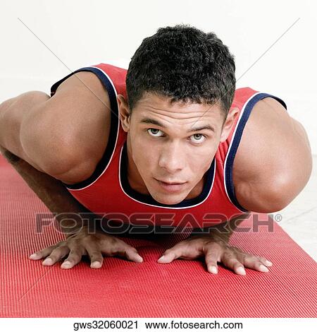 Portrait of a young man doing push-ups View Large Photo Image Stock Image - Portrait of a young man doing push-ups. Fotosearch