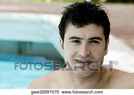 Portrait of a young man in a swimming pool View Large Photo Image Stock Image - Portrait of a young man in a swimming pool. Fotosearch