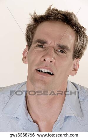 Portrait of a young man looking confused View Large Photo Image Stock Photograph - Portrait of a young man looking confused. Fotosearch
