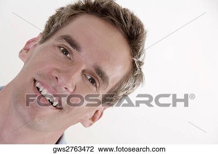 Portrait of a young man smiling View Large Photo Image Stock Image - Portrait of a young man smiling. Fotosearch