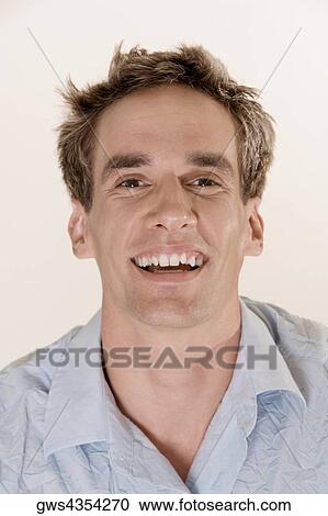 Portrait of a young man smiling View Large Photo Image Stock Image - Portrait of a young man smiling. Fotosearch