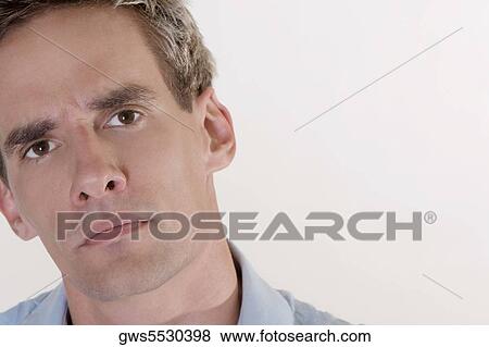 Portrait of a young man thinking View Large Photo Image Stock Photo - Portrait of a young man thinking. Fotosearch
