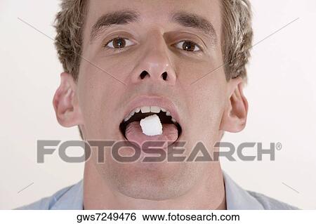 Portrait of a young man with candy in his mouth View Large Photo Image Stock Photograph - Portrait of a young man with candy in his mouth. Fotosearch