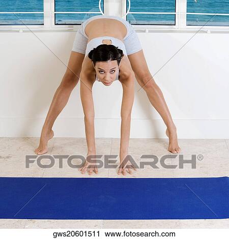 Portrait of a young woman exercising on the floor View Large Photo Image Stock Image - Portrait of a young woman exercising on the floor. Fotosearch
