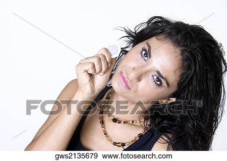 Portrait of a young woman holding a condom View Large Photo Image Stock Photo - Portrait of a young woman holding a condom. Fotosearch