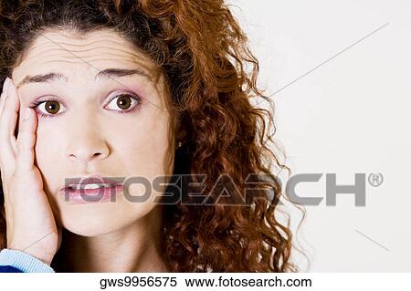 Portrait of a young woman looking worried View Large Photo Image Stock Photography - Portrait of a young woman looking worried. Fotosearch