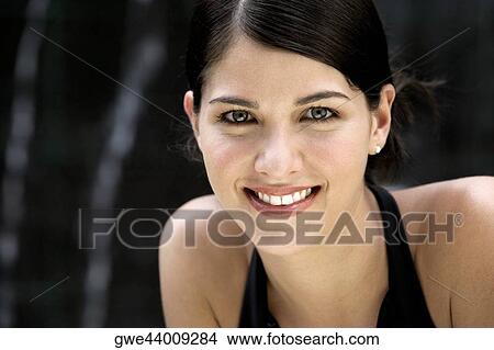 Picture - Portrait of a young woman smiling. Fotosearch