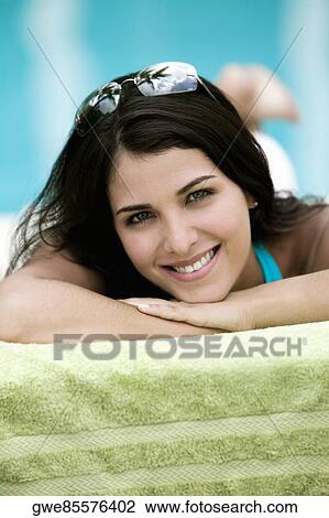 Portrait of a young woman smiling View Large Photo Image Stock Image - Portrait of a young woman smiling. Fotosearch