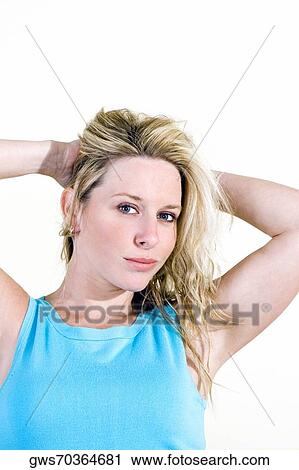 Stock Image - Portrait of a young woman smiling. Fotosearch