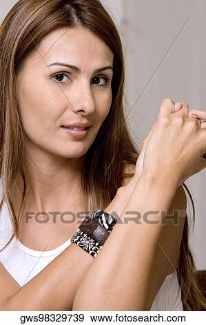 Portrait of a young woman smiling View Large Photo Image Stock Photo - Portrait of a young woman smiling. Fotosearch