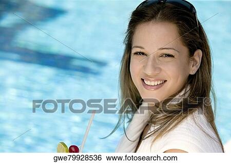 Stock Photograph - Portrait of a young woman smiling. Fotosearch