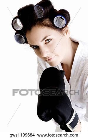 Picture - Portrait of a young woman wearing boxing gloves. Fotosearch