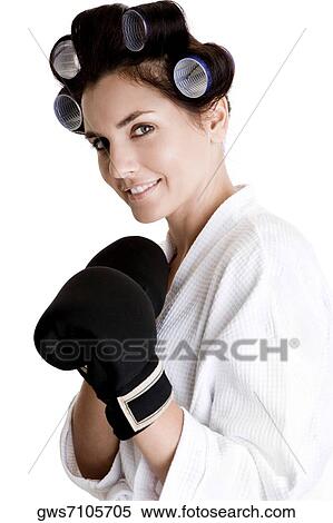 Portrait of a young woman wearing boxing gloves View Large Photo Image Stock Photography - Portrait of a young woman wearing boxing gloves. Fotosearch
