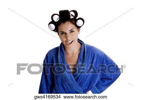 Portrait of a young woman with curlers in her hair sticking out her tongue View Large Photo Image Picture - Portrait of a young woman with curlers in her hair sticking out her tongue. Fotosearch