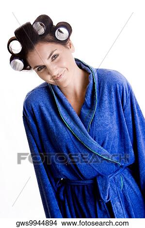 Portrait of a young woman with curlers in her hair View Large Photo Image Picture - Portrait of a young woman with curlers in her hair. Fotosearch