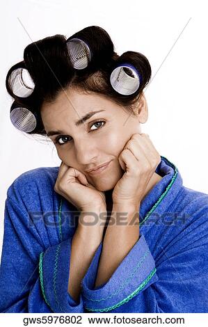 Portrait of a young woman with curlers in her hair View Large Photo Image Stock Image - Portrait of a young woman with curlers in her hair. Fotosearch