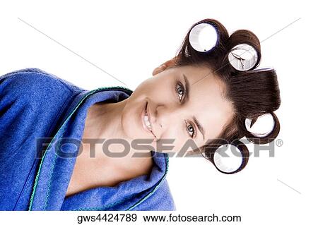 Portrait of a young woman with curlers in her hair View Large Photo Image Stock Photo - Portrait of a young woman with curlers in her hair. Fotosearch