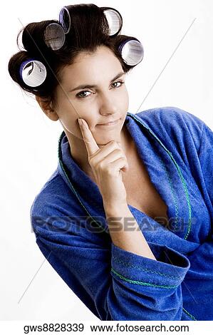 Portrait of a young woman with curlers in her hair View Large Photo Image Stock Photo - Portrait of a young woman with curlers in her hair. Fotosearch