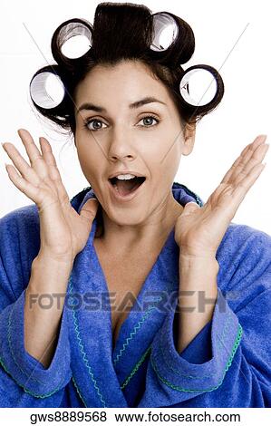 Portrait of a young woman with curlers in her hair View Large Photo Image Stock Photo - Portrait of a young woman with curlers in her hair. Fotosearch