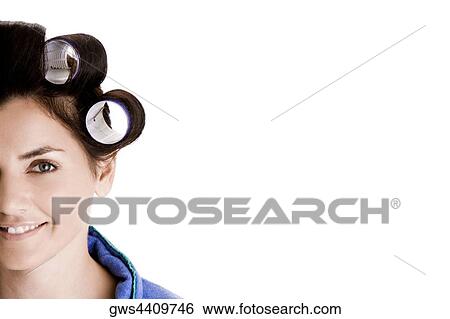 Portrait of a young woman with curlers in her hair View Large Photo Image Stock Photograph - Portrait of a young woman with curlers in her hair. Fotosearch