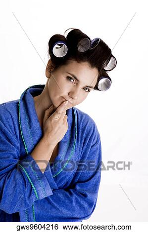 Portrait of a young woman with curlers in her hair View Large Photo Image Stock Photograph - Portrait of a young woman with curlers in her hair. Fotosearch