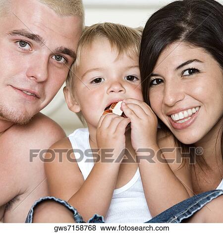 Stock Photo - Portrait of parents with their son. Fotosearch