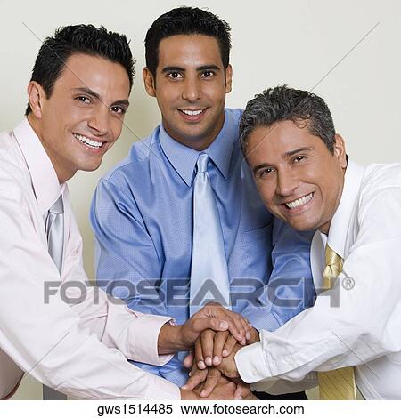 Portrait of three businessmen shaking hands View Large Photo Image Stock Photography - Portrait of three businessmen shaking hands. Fotosearch